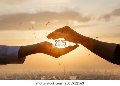 Concept of protecting the future 2025. Hands protect the new year 2025 with a gesture. - Powered by Shutterstock