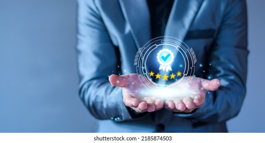 The concept of providing a five-star premium service. businessman showing award High standards are guaranteed, service quality, business success, work efficiency, top quality assurance 5 stars. - Shutterstock ID 2185874503