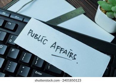 Concept of Public Affairs write on sticky notes isolated on Wooden Table.