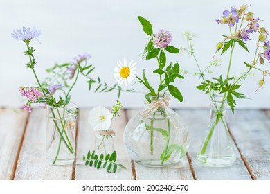 Concept Of Pure Natural Organic Herbal And Flower Ingredients In Cosmetic Production. Camomile, Lavender Essential Oils For Gentle Face And Body Care. Aromatherapy. Wooden Background, Copy Space