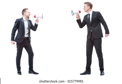 Concept of quarrel or politics debate.Two angry stressed businessman are shouting on each other with megaphones. Full length studio portrait isolated on white. - Powered by Shutterstock