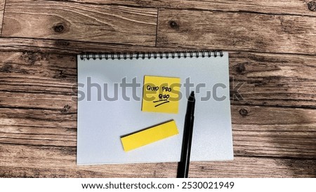 Concept of Quid Pro Quo write on sticky notes isolated on Wooden Table.