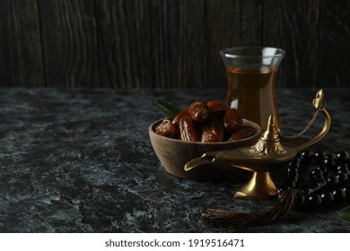 Concept Of Ramadan With Food And Accessories On Black Smokey Background