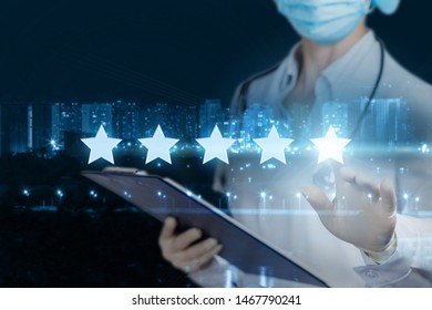 The Concept Rating Of Medical Care. The Doctor Clicks A Star On The Blurred Background Of The City.