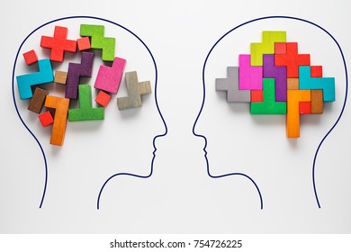 The concept of rational and irrational thinking of two people. Heads of two people with colourful shapes of abstract brain for concept of idea and teamwork. Two people with different thinking. 