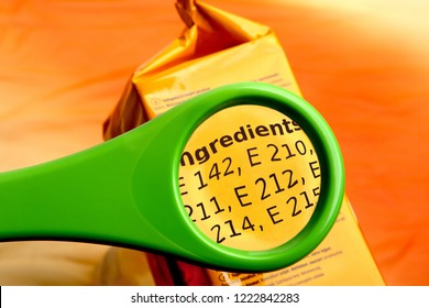 Concept of reading ingredients list on food package with magnifying glass. Magnifying glass on food additives label. 
 - Shutterstock ID 1222842283