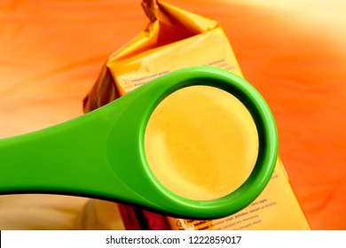 Concept Of Reading Ingredients List On Food Package With Magnifying Glass. Empty Magnifying Glass On Food Additives Label. 