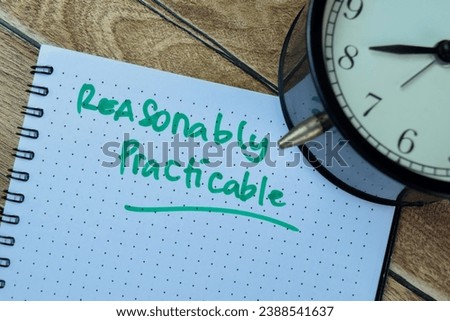 Concept of Reasonably Practible write on book isolated on Wooden Table.