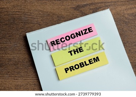 Concept of recognize the problem write on sticky notes isolated on Wooden Table.