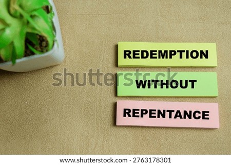 Concept of redemption without repentance write on sticky notes isolated on Wooden Table. For forgiveness, moral dilemmas and the complexity of spiritual