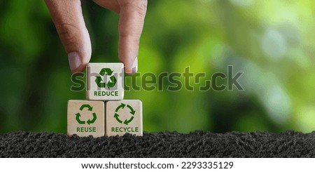 concept, reduce, reuse, recycle, recycle symbol Hand placed wooden block with green recycle icon. Ecology. Ecological metaphor for ecological waste management reduce, reuse, recycle. Foto stock © 