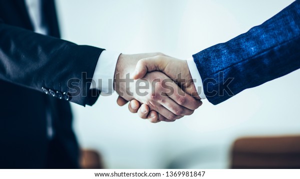 concept of a reliable partnership : a handshake of\
business par