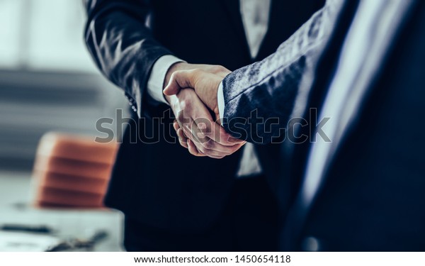 concept of a reliable partnership : a handshake of\
business part