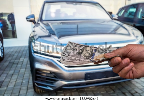 concept of rent or buy new car. finance concept.\
dollar  in male dollar