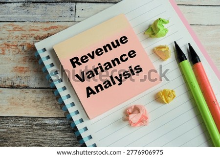 Concept of revenue variance analysis write on sticky notes isolated on Wooden Table.