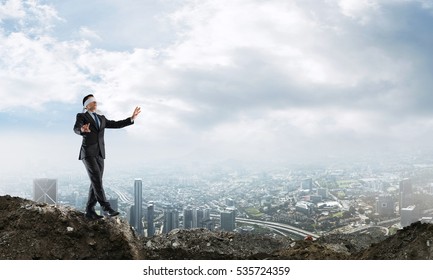 Concept of risk and danger in business with man steping blind - Shutterstock ID 535724359