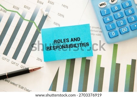 Concept of Roles and Responsibilities write on paperwork isolated on Wooden Table.