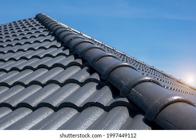 concept for roof housetop icon with grey roofing tiles. banner texture for roofers