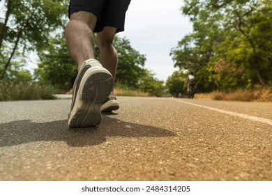 The concept of running on a path, legs close-up - Powered by Shutterstock