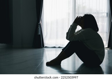 Concept of sad teenage girl depression. Upset teenage girl sitting at floor indoors. Anxiety young woman Despair and stress. Lonely and unhappy female are social victims. loneliness youth in home. - Shutterstock ID 2252503997