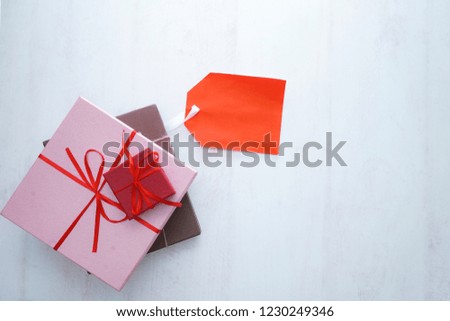 Concept sales, black Friday, discount with tag, some prize and flower on a wooden background Copyspace. Flat Layout