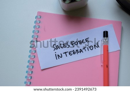 Concept of SalesForce Integration write on sticky notes isolated on Wooden Table.