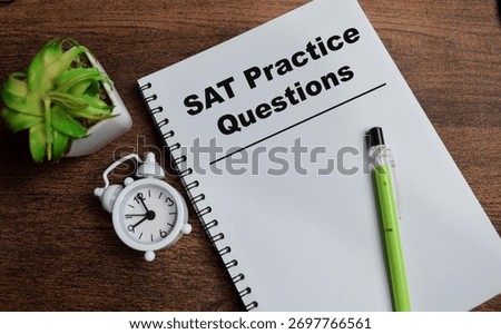 Concept of SAT practice questions write on book isolated on Wooden Table.