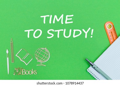 concept school, text time to study, school supplies, notebook, ruler and pen on green backboard