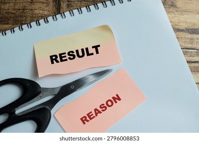Concept of scissors result and reason write on sticky notes isolated on Wooden Table. For different ways of thinking to succeed