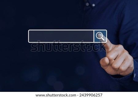 Concept of searching data,network web and technology. A man touching the magnifying glass icon for searching data information networking