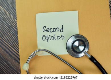 Concept Of Second Opinion Write On Sticky Notes Isolated On Wooden Table.