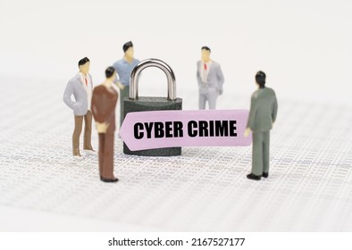 The Concept Of Security In Business. There Are Figures Of People On Business Reports, A Padlock With A Sticker On Which It Is Written - Cyber Crime