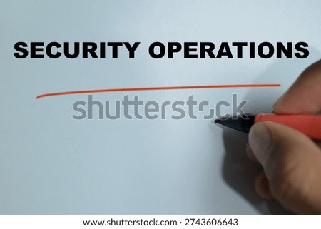 Concept of security operations write on book isolated on Wooden Table. For cybersecurity management, monitoring, IT systems defense and enterprise network protection services