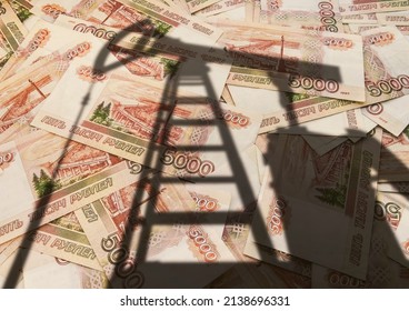 concept of selling minerals for Russian rubles. The shadow of the oil rig against the background of Russian money. Earn money from mining gas and oil energy resources