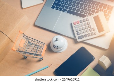 Concept Of Selling Products Online Top View Image Of Small Business Desk Or Start Up Online Marketing Business Entrepreneur With Packaging Box, Laptop, Calculator.
