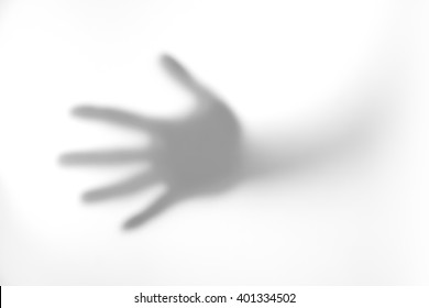 The Concept Of The Shadow Of Hand Behind Frosted Glass Illuminated From Behind.