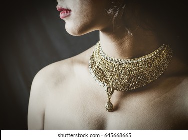   Concept Shoot With A Model Wearing A Jewellery Gold Neckpiece At A Studio