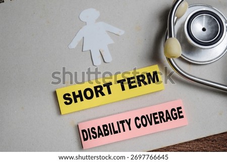 Concept of short term disability coverage write on sticky notes isolated on Wooden Table.