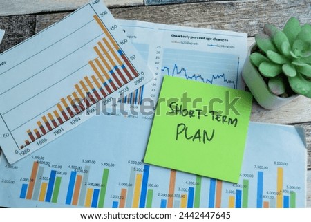 Concept of Short-Term Plan write on sticky notes isolated on Wooden Table. stock market concept