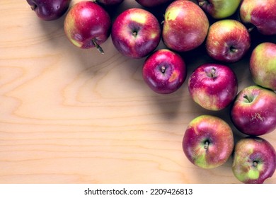 Concept For An Simple Autumn Background. Close-up Of Fresh, Organic Apples On A Wooden Table. Flat Lay, Top View. Copy Space.