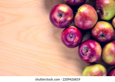 Concept For An Simple Autumn Background. Close-up Of Fresh, Organic Apples On A Wooden Table. Flat Lay, Top View. Copy Space.