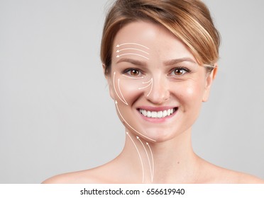 Concept of skin rejuvenation. Face lift anti-aging treatment - woman with massage lines showing facial lifting effect on skin  - Powered by Shutterstock