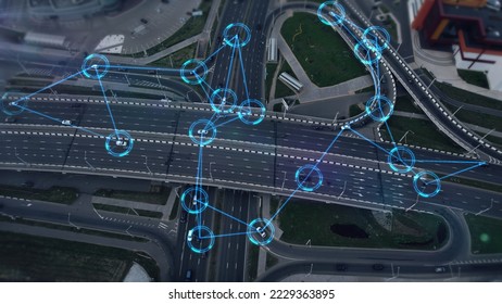 Concept of smart cars and transportation of the future. Automated robotic system remotely controls self-driving cars in the city. Artificial Intelligence Digitalizes and Analyzes Roads. Aerial view. - Shutterstock ID 2229363895