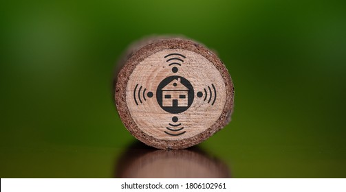 Concept of smart home with icon on wooden log