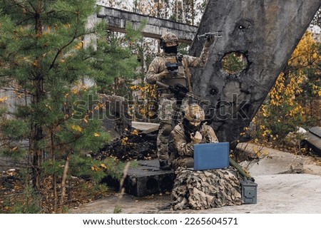 Concept smart war robots. Soldier engineer use laptop for transmits aerial photo and data from drone to artillery headquarters military.