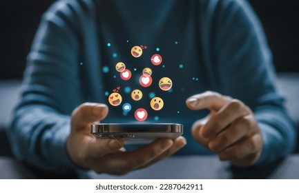 Concept of social media communication and digital online, people use smartphone playing with icon online social media, online marketing, technology, chat, post, like, follow at phone screen - Shutterstock ID 2287042911