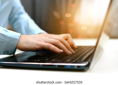 concept of social networks and human interaction with the virtual world through a laptop, receiving letters and likes - Shutterstock ID 1641017533