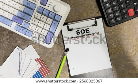 Concept of SOE - State-Owned Enterprise write on paperwork isolated on Wooden Table.