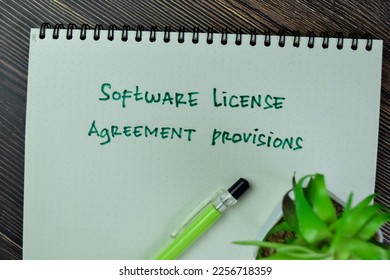 Concept of Software License Agreement Provisions write on a book isolated on Wooden Table. - Shutterstock ID 2256718359