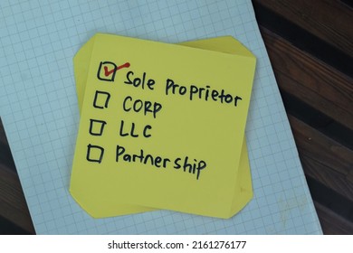 Concept Of Sole Proprietor Write On Sticky Notes Isolated On Wooden Table.